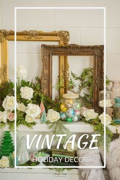 vintage holiday decor with white roses and greenery in front of an ornate gold frame