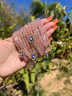 Milky pink beaded bracelet with an evil eye charm for protection ✨ Pink Spiritual Jewelry With Evil Eye, Pink Evil Eye Spiritual Jewelry, Pink Spiritual Evil Eye Jewelry, Adjustable Pink Beaded Evil Eye Bracelet, Handmade Pink Evil Eye Bracelet With Round Beads, Pink Beaded Evil Eye Bracelet With Round Beads, Pink Evil Eye Bracelets With Round Beads, Pink Beaded Bracelets With Evil Eye, Pink Bracelets With Evil Eye Round Beads