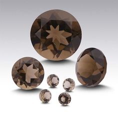 an assortment of brown diamonds on a white background