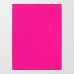 a bright pink piece of paper on a white surface