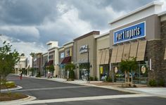 an empty street in front of a pet shop