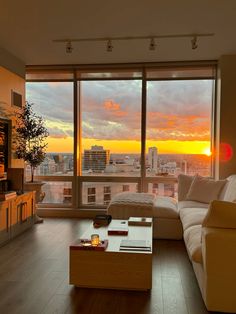 a living room filled with furniture and a large window