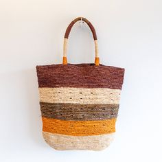 IN STOCK FAST SHIPPING FROM LOS ANGELES This large tote is the ultimate summer bag, perfect for a day at the beach or a casual chic outing. Made of natural soft raffia straw and accented with colorful stripes, this durable and fashionable tote is a must-have accessory. Stay on trend with this versatile and stylish bag. Dimensions: 16"H x 17"W Designer Style ID: 8634 Multicolor Double Handle Hobo Bag For Beach, Multicolor Hobo Bag With Braided Handles For Beach, Woven Top Handle Beach Bag, Woven Top Handle Beach Bag For Shopping, Natural Straw Shopping Bag With Top Handle, Handwoven Natural Fiber Bags For Beach Season, Natural Top Handle Straw Bag For Shopping, Beach Hobo Bag With Leather Top Handle, Beach Hobo Bag With Top Handle And Leather Details