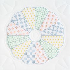 a cross stitch pattern on a white background with the colors of rainbows and stars