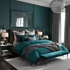 a bedroom with teal and grey colors