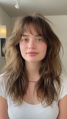 22 Flattering Hairstyles for Women with Big Foreheads Bangs For Sharp Face, Womens Wispy Bangs, Medium Long Length Hair With Layers And Bangs, Bold Layers Long Hair, Haircuts For Grown Out Bangs, Layers Haircut Bangs, Wispy Bangs Long Shag, Heavy Layers With Bangs, Hair Cuts For Bigger Foreheads