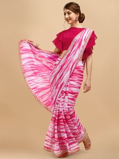 Pink and white sareeTie and dye dyed saree with embroidered borderThe saree comes with an unstitched blouse pieceThe blouse worn by the model might be for modelling purpose only. Check the image of the blouse piece to understand how the actual blouse piece looks like. Eid Bandhani Print Blouse For Puja, Transitional White Saree With Sheer Dupatta, Pre-draped Bandhani Print Saree, Pre-draped Bandhani Saree In Traditional Drape, Transitional Season Sheer Dupatta Saree, Traditional Blouse With Sheer Dupatta For Puja, Bandhani Print Blouse With Traditional Drape, Traditional Drape Georgette Blouse With Bandhani Print, Traditional Drape Blouse In Bandhani Print Georgette