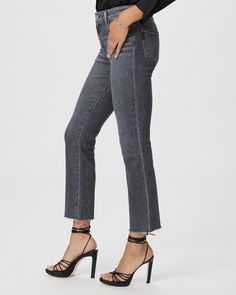 This high-rise, perfectly straight jean is lean through the leg and finishes at the ankle with a raw hem. This pair is cut from PAIGE Vintage denim in a grey wash with whiskers and a marble texture. PAIGE Vintage takes all of the work out of breaking in your favorite pair of vintage jeans. We've combined the comfort of stretch with everything you love about authentic vintage denim to create super soft jeans that feel perfectly lived-in from the very first wear. | Cindy Straight Jean - Ash Black Washed Black Straight Leg Jeans With Frayed Hem, Gray Straight Leg Jeans For Fall, Gray Mid-rise Bottoms With Frayed Hem, Chic Gray Mid-rise Jeans, Gray Fall Jeans With Frayed Hem, Gray Frayed Hem Jeans For Fall, Gray Frayed Hem Jeans For Spring, Gray Jeans With Frayed Hem For Fall, Gray Jeans With Frayed Hem For Spring