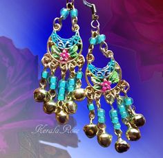 "These Small Floral belly dancer Chandelier Earrings are made with hand-painted plated floral pendants adorned with colorful glass beads and dangling jingle bell charms. Available with French Wires, Leverbacks, Posts or Clip-Ons.   -2 1/2\" Long x 1\" Wide -0.1 oz. ea -Many Colors Available in the pull-down menu! (Periwinkle is seen in the video) Metal Finishes Available: -Gold -Silver  Longer Version: https://www.etsy.com/listing/251271742/ready-to-ship-silver-gypsy-bellydancer?ref=shop_home_ac Festival Party Chandelier Earrings With Dangling Beads, Festive Bohemian Chandelier Earrings With Dangling Beads, Traditional Blue Chandelier Earrings For Festivals, Blue Traditional Chandelier Earrings For Festivals, Traditional Chandelier Earrings With Blue Dangling Beads, Traditional Blue Chandelier Earrings For Party, Traditional Chandelier Earrings With Colorful Beads For Festival, Festive Bohemian Beaded Earrings, Multicolor Bohemian Chandelier Earrings For Celebrations