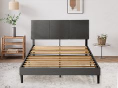 a bed frame with wooden slats in a bedroom