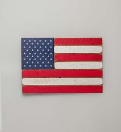 an american flag made out of wood on a wall