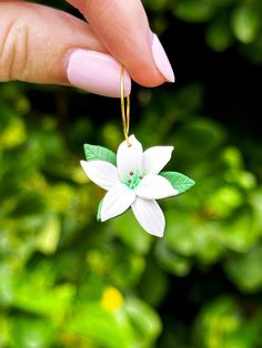 Take your floral fashion game to the next level with these beautiful Oriental Lily Hoops! These earrings look so real you'll feel like you have a tiny garden growing on each ear. A subtle way to show off your love of nature that will definitely turn heads! Earring hooks are nickel free silver, and studs/ball posts, and hoops are stainless steel. If you would like to swap out the pictured findings for another style, just leave a note for me at checkout! Earring Care: - Avoid contact with makeup or alcohol - Store in a cool, dry place - Keep dry (don't wear in the shower or swimming) - Clean with a damp cloth if needed - Be gentle with them! I try to make them as durable as possible, and polymer clay can be quite sturdy, but they aren't indestructible. Disclaimer: All earrings are individual Alcohol Store, Lily Earrings, Tiny Garden, Garden Growing, So Real, Earrings Flower, Star Gift, Floral Fashion, Earring Hooks