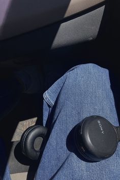 headphones sitting on the seat of a car