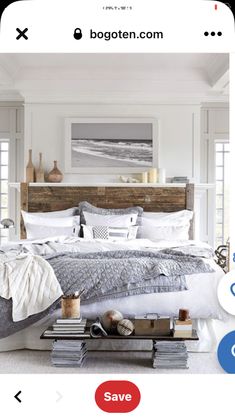 a bedroom with white walls and flooring has a wooden headboard on the bed