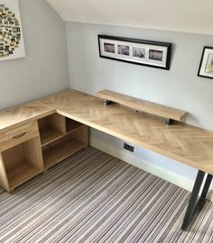 the corner desk is made from wood and has two shelves on each side, along with an open shelf