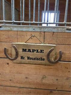 a wooden box with some metal handles hanging from it's sides and the words maple mr moustache on it