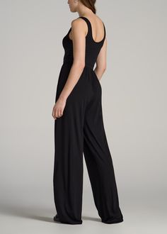 The Tall Woman's Dream Jumpsuit Elegance and Ease in One Piece Discover the Jersey Tank Wide Leg Women's Tall Jumpsuit – a single piece that makes a complete outfit. Designed for the tall, modern woman, this jumpsuit is a fusion of comfort and fashion with its soft tencel-spandex blend and a flowy wide-leg design. The full-length, sleeveless design, complemented by side seam pockets, offers both convenience and style. Whether you're stepping out for a casual day or dressing up for an evening eve Black Sleeveless Elastane Jumpsuits And Rompers, Sleeveless Elastane Bodysuit For Evening, Sleeveless Bodysuit For Evening, Black Elastane Jumpsuits And Rompers For Work, Black Elastane Jumpsuits For Workwear, Black Elastane Jumpsuit For Work, Elegant Black Elastane Bodysuit, Formal Sleeveless Elastane Jumpsuits And Rompers, Elegant Black One-piece Jumpsuit