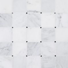 white marble tiles with black dots on them