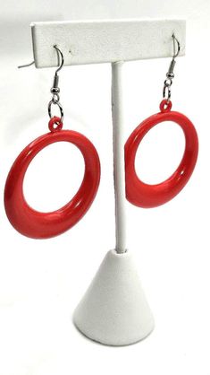 Big red dangling hoop statement earrings right out of the 80's. They are hooked for pierced ears and measure over 2.75" from the top of the hook and 1.5" across. Rad! Expedited shipping is available by request on a case by case basis. Please message us if you require rush shipping. Returns are are accepted within the time window noted. To recieve a full refund the return must meet one of the following criteria. All other returns are subject to restocking fees. 1. Item was late or not delivered 2 80s Memories, 1980s Jewelry, 80s Earrings, Red Power, 1980s Fashion, The 80's, Etsy Earrings Dangle, Pierced Ears, Gift Registry