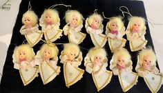 twelve blonde christmas angel ornaments are on display