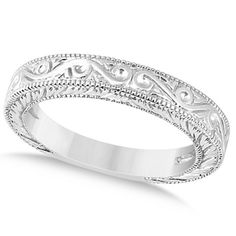 a wedding band with intricate designs on it