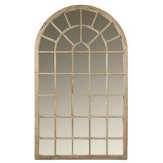 an arched window is shown against a white background, with the reflection of it in the mirror