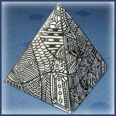 a black and white origami piece on a blue background with the words, how to make an origami pyramid