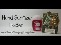 a bottle of hand sanitizer sitting next to a christmas tree ornament