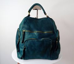 "Teal Blue Soft Leather Backpack, Teal Blue Italian Bag, Customizable, Handmade Leather Backpack for Women, Leather Backpack, Aim This bag has made by our italian partner and personalized by our team. We offer one free monogram or name personalization. Please check fonts, color thread, tag samples and leave your monogram or name to embroider. Our new Aim leather backpack is a beautifully handmade small leather bag, W 10.2 \" x H 11.8\" x D 4.7\", smart solution for carry your stuff keeping your Large Capacity Blue Leather Backpack, Blue Leather Backpack With Large Capacity, Blue Satchel Leather Backpack For On-the-go, Blue Leather Satchel Backpack For On-the-go, Blue Leather Backpack With Large Capacity For Everyday Use, Large Capacity Blue Leather Backpack For Everyday Use, Blue Leather Backpack With Removable Pouch For Daily Use, Blue Leather Backpack With Removable Pouch, Soft Leather Backpack