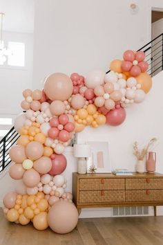 a staircase made out of balloons in the shape of an airplane on top of a wooden floor