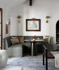 a living room filled with furniture and a fire place