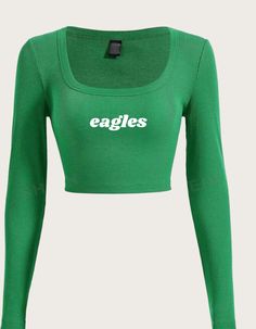 a green crop top with the word eagles on it