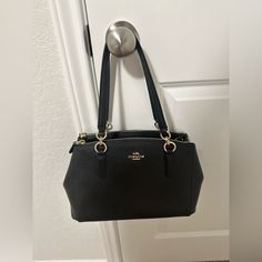 Never Used. In Great Condition. Original Price $395. I Think I Threw Away The Dust Bag. I Can’t Find It. Black Office Bags With Gold-tone Hardware, Black Formal Bags With Double Handle, Black Double Handle Formal Bag, Coach Black Satchel With Handle Drop, Elegant Black Satchel With Gold-tone Hardware, Black Shoulder Bag With Gold-tone Hardware For Formal Occasions, Formal Black Shoulder Bag With Gold-tone Hardware, Black Formal Shoulder Bag With Double Handle, Coach Black Top Handle Shoulder Bag