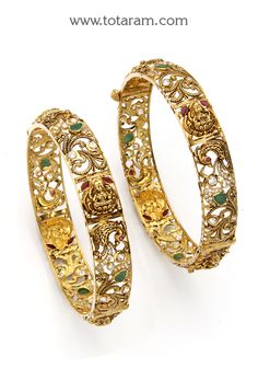 22 karat gold 'lakshmi - peacock' kada - set of 2 (1 pair) with cz & color stones (temple jewellery)
  note : this item comes with a screw and hinge so that you can open it up for easy wearing.

introducing the exquisite 22 karat gold 'lakshmi - peacock' kada - set of 2 (1 pair) with cz & color stones, exclusively crafted by totaram jewelers. made in india, this stunning piece of temple jewellery is designed for women in the adult age group. 
  
  experience the beauty and elegan 22k Gold Bangles, Gold Bangles For Women, Gold Bangle Set, Color Stones, Peacock Design, Gold Jewelry Indian, Temple Jewellery, Bangle Set, Gifts For Adults