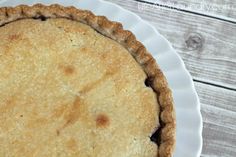 a pie sitting on top of a white plate