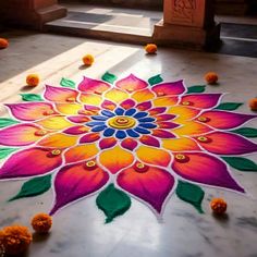 a colorful flower is on the ground with petals around it