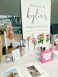 there is a sign that says welcome to kyllie's graduation party on the table