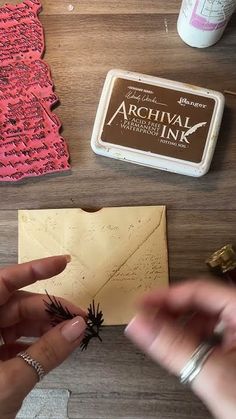 someone is working on some type of crafting project with wood and acrylic ink