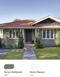 the exterior of a house with gray paint and brown shingles on it's roof