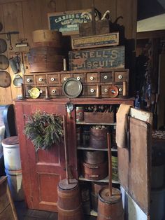 an old fashioned kitchen with lots of pots and pans