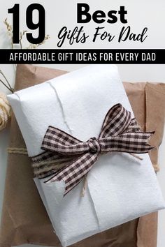 a present wrapped in brown paper with the words best gifts for dad on it and an image