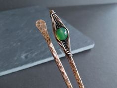 This beautiful set of 2 hair sticks are made of solid copper wire or solid brass, hammered to give texture and stiffen the thick gauge wire. In one of the hair stick I wrapped a green agate and the other one is a simple hammered hair pin. You can choose several lengths of hair stick but if you need one shorter or larger leave the measurement in checkout. You may need to fix your bun with some additional bobby pins or a gum to hold better your bun and then add the hair pin, more as a decorative j How To Clean Silverware, Brass Hair Pin, Dark Green Hair, Hair Stick, Green Gems, Green Agate, Hair Sticks, Hair Pin, Agate Beads