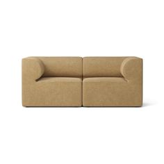 a beige couch sitting on top of a white floor