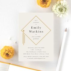 a white and gold graduation party card on top of a table