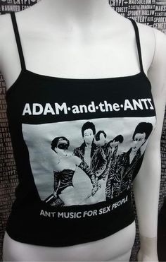 This is a black Adam and the Ants crop tank top with spaghetti straps. This has a Adam Ant image screen printed on the front. 95% cotton/ 5% SpandexThese are handmade screenprinted and slightly vary from the photo. Please feel free to email me any questions. Thanks for looking.I do not do exchanges and I do not take returns unless the item is damaged. I thoroughly check each item before it is shipped out. Ant Image, New Wave Goth, Adam And The Ants, Adam Ant, Black Adam, White Crop Tank, White Crop Top Tank, Black Cropped Tank, Black Crop Top Tank