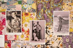 an assortment of photographs are displayed on a wall covered in colorful fabrics and paper flowers