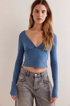 The flattering femme shape of this soft cotton long sleeve from We The Free makes it the perfect elevated, everyday basic. **Fit:** Cropped, fitted **Features:** Soft, washed cotton fabrication, plunging V-neckline, seamed underbust, smocked backing, long fitted sleeves, exposed seams **Why We | We The Free Ivy Long Sleeve at Free People in Blue, Size: S Womens Long Sleeve Tops, Free People Long Sleeve Top, Cute Fitted Tops, Free People Shirts, Long Sleeve Going Out Tops, Free People Outfits, Longsleeves Outfit, Cute Long Sleeves, Everyday Fits