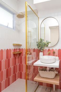 a white sink sitting under a mirror in a bathroom