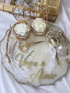 there is a tray with some flowers and other items on the table, as well as wedding decorations