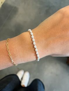 This bracelet is a silver beaded bracelet with alternating bead sizes. The larger bead size is a 4mm and the smaller bead size is a 2mm. Made with 4mm pearls and 2mm 14kt gold-filled beads Worry-free wear‚ which means sleep, shower and sweat in it Hand beaded on high performance elastic for a slight stretch to easily roll on and off your wrist Measures 6.25" Pearl Bead Bracelet, Silver Beaded Bracelet, Bead Sizes, Silver Bead Bracelet, Bracelet Silver, Christmas Wishlist, Hand Beading, 14kt Gold, Bead Bracelet